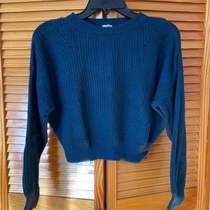 teal colored sweater garage